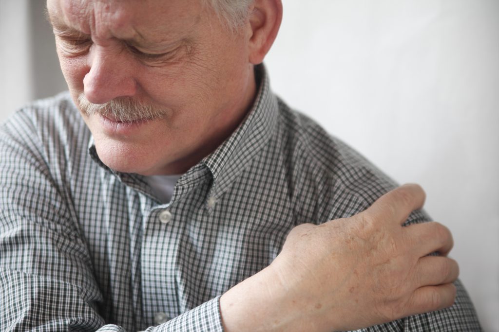 older man with pain in shoulder