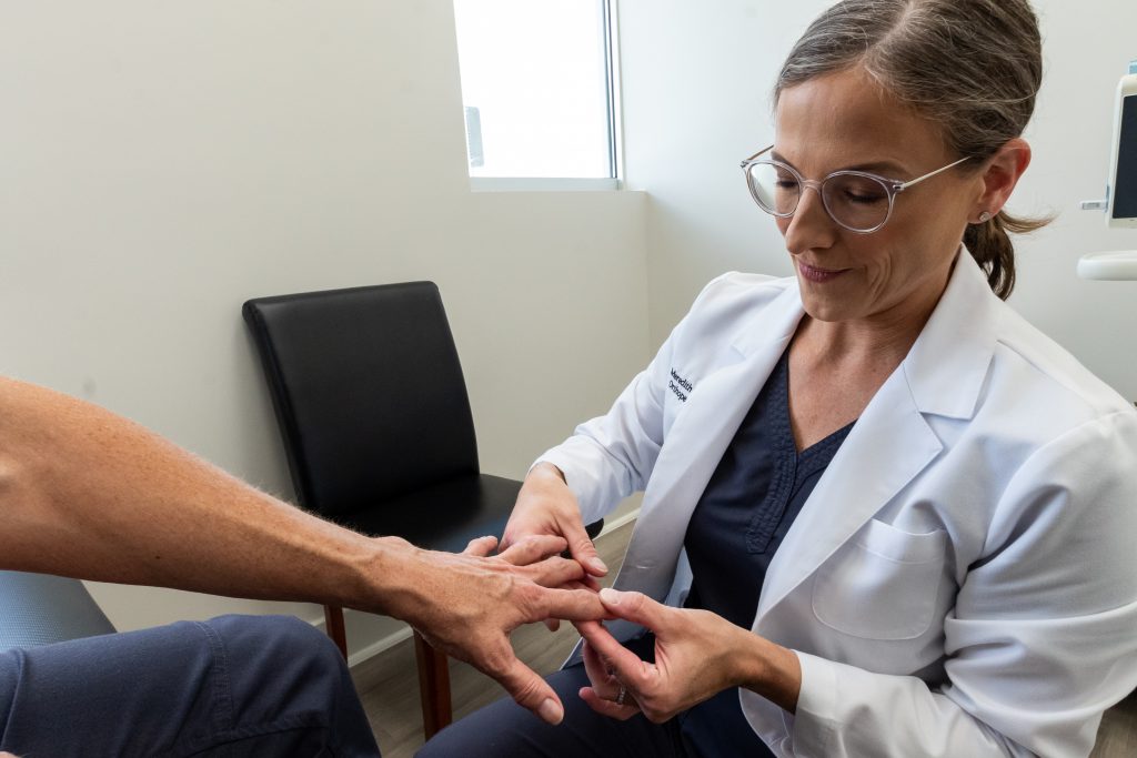 Why Should I See An Orthopedic Surgeon? - Examining Fingers